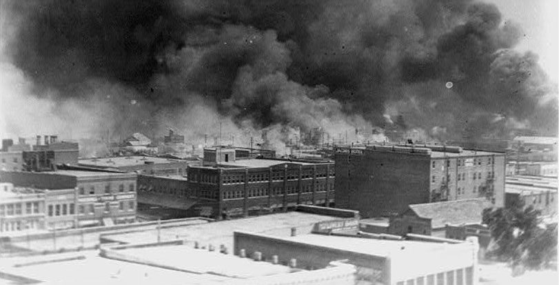 old picture of buildings burning